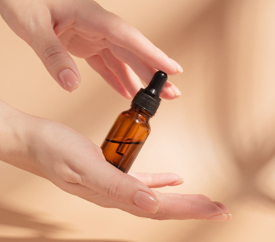 Skin Benefits of the Frankincense oil - oil serum held by a hand